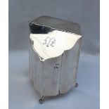 An Edwardian silver tea caddy, with a tapering hinged fall,