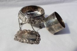 A George III silver open table salt of cauldron shape, embossed with flowers and leaves,
