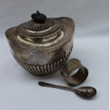 A late Victorian silver sugar box and cover, of oval form with a reeded body on an oval foot,