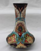A Moorcroft pottery single stem vase decorated in the bukhara pattern, limited edition No.