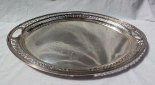 An Edward VII silver tray of pierced oval form, decorated with scrolling leaves, Sheffield, 1902,