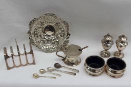 A late Victorian silver bon bon dish, with pierced and embossed decoration of flowers and scrolls,