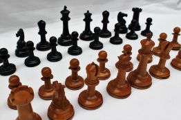 A Staunton pattern ebony and boxwood chess set, kings,