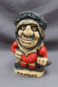A John Hughes pottery Grogg of a rugby player in a red jersey with the number 1 on his back titled