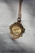 An Edward VII gold sovereign dated 1906, in a 9ct yellow gold slip setting and chain,
