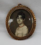 19th century British School Head and shoulders portrait of a young lady A miniature 5.5 x 4.