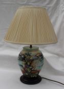 A Moorcroft pottery table lamp decorated in the "Islay" pattern with sea shells and flowers, lamp,