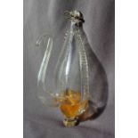 A 19th Century clear glass water barometer, with a moulded suspension loop and long slender spout,