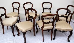 A set of eight Victorian rosewood balloon back dining chairs,