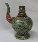 A Chinese famille verte ewer, decorated with fish, flowers and leaves, seal mark to the base, 19.