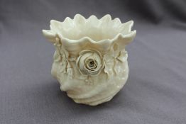 A Belleek porcelain vase applied with a rose, leaves and shamrock, black printed mark,