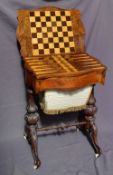 A Victorian burr walnut games / work table, the hinged shaped moulded top enclosing a chequer board,