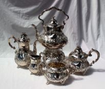 A Victorian silver four piece teaset, comprising hot water pot, teapot, sugar basin and cream jug,