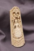 A 19th century continental ivory tobacco rasp depicting figures emerging from a woodland,