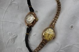 A 9ct yellow gold Lady's wristwatch together with a 9ct yellow gold wristwatch on a textured link