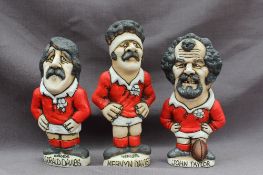 Three John Hughes pottery Groggs, of Welsh Rugby players including "John Taylor", 16cm high,