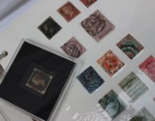An 1840 Penny Black stamp, "M I" in a perspex box for CPM Philatelics,