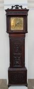 A 19th century carved oak longcase clock,