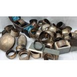 A large collection of silver napkin rings,