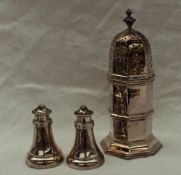 An Edward VII silver sugar caster, of octagonal form, the pierced domed lid with a turned finial,