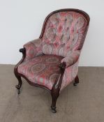 A Victorian walnut spoon back library chair, with button back upholstery,