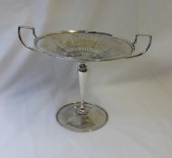 An Edward VII silver twin handled pedestal dish, with a pierced centre,