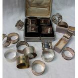 A set of four George VI silver napkin rings, London, 1944,