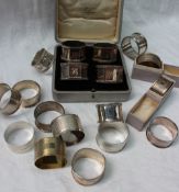 A set of four George VI silver napkin rings, London, 1944,