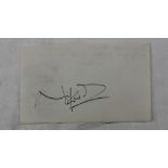 Noel Coward - an autographed slip of paper in black ink