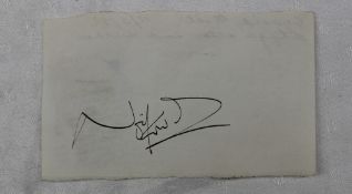 Noel Coward - an autographed slip of paper in black ink