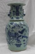 A Cantonese porcelain baluster vase, with a flared rim and dog of foo handles,