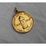 Of military and local interest - An 18ct yellow gold medallion,