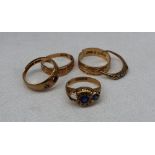 Four assorted 18ct yellow gold rings, some gem set, approximately 12.