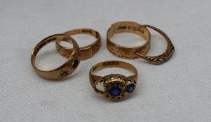 Four assorted 18ct yellow gold rings, some gem set, approximately 12.