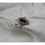A diamond dress ring of pointed oval shape,