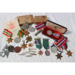 A collection of World War II medals including the 1939-45 Star, Italy Star, France and Germany Star,