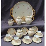 A 19th century continental porcelain part tea service comprising a twin handled tray, two teapots,