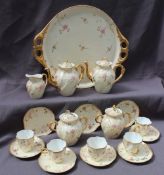 A 19th century continental porcelain part tea service comprising a twin handled tray, two teapots,