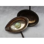 A white metal toddy ladle,