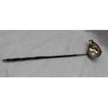 A George III silver toddy ladle, inset with a George II coin dated 1758, on a twisted horn handle,