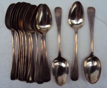 A matched set of fourteen silver dessert spoons, various dates and makers,