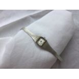 A lady's 9ct white gold Rotary wristwatch with a rectangular dial and batons,