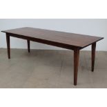 A 20th century oak refectory table with a rectangular planked top on four square tapering legs,