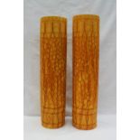A pair of Burmantofts faience vases of cylindrical form with geometric patterns,