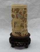An early 20th century Chinese carved ivory brush pot, decorated with piercing,