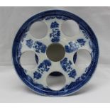 A 19th century blue and white moth and willow pattern pearlware egg stand,