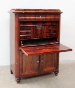 A 19th century French Secrétaire à abattant, with a stepped top and frieze drawer,