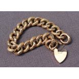 A 9ct yellow gold bracelet with textured oval links and a padlock clasp, approximately 32 grams,