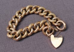 A 9ct yellow gold bracelet with textured oval links and a padlock clasp, approximately 32 grams,