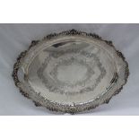 A George V silver twin handled tray, with a pierced border,